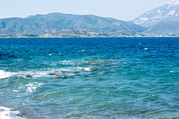 sea mountain scape nature idyllic picturesque summer scenic view with slightly mist and waterfront shore line district Mediterranean Europe region space