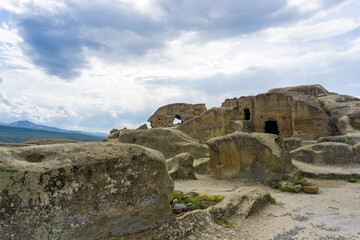 View of the ruins of the residential caves of the ancient city. Uplistsikhe is an ancient rock-hewn town.