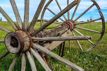 An old wooden wheel with a metal rim