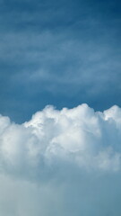 Obraz premium Summer Or Spring Sky With Cloudscape Scattered Across Horizon. Clear Blue Sky And White Clouds Summer Background. Vertical Time Lapse.