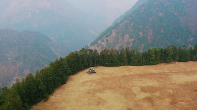 4K Aerial view of alpine meadows of Shangarh village in Sainj Valley, Himachal Pradesh, India. Celestial meadows, majestic temples with kath kuni architecture. Mountains landscape.