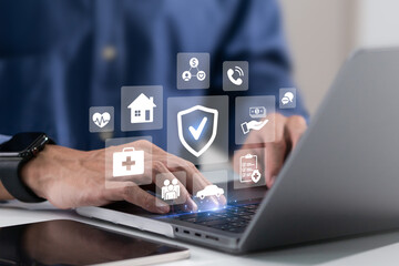 Insurance online. Businessman using a laptop to insurance for car, travel, family and life,...