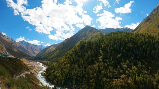 4K time lapse of scenic mountain valley, river and clouds at Chhitkul  village in Kinnaur district, Himachal Pradesh. Heavenly mountain landscape. travel, tourism and holidays concept 