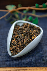 A CloseUp View of Beautifully Dried Herbal Tea Leaves Organized Neatly in a White Dish for Display