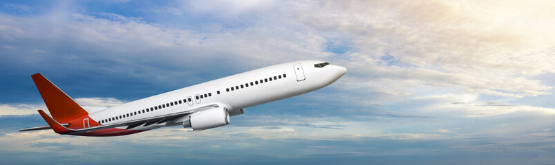 Commercial airplane flying in the sky with cloudscapes background
