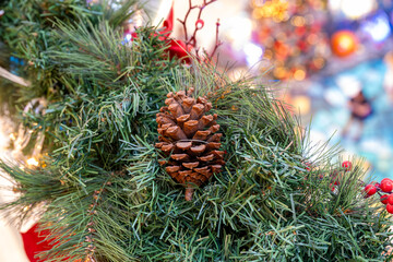 Capture the magic of the holiday season with this close-up image of a Christmas tree adorned with shimmering ornaments, sparkling lights, and festive decorations.  