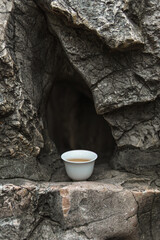 Enjoying a calm tea moment while fully embracing the beauty and tranquility of nature