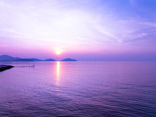 Aerial view sunset sky,Nature beautiful Light Sunset or sunrise over sea,Colorful scenery Sky with Amazing clouds and waves in sunset sky purple light cloud background