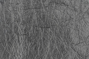 Abstract dark gray color artificial leather pattern for background. Close-up photo of shadow light black color surface level imitation leather material, wrinkle background texture, free copy space