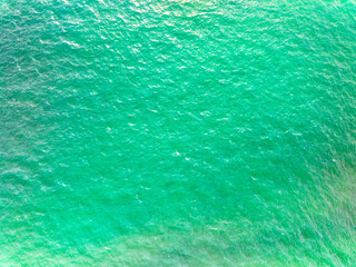 Sea surface aerial view,Bird eye view photo of small waves texture water surface turquoise sea background,Beautiful sea nature, Amazing view waves background