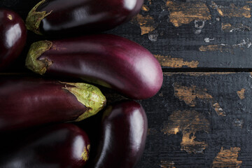 Homegrown Purple Eggplants on Rustic Wooden Surface, Organic Ecological Food, Copy Space