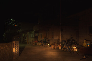 A serene and quiet night scene captured in a charming, rural alleyway, inviting exploration