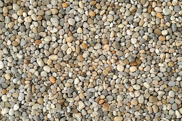 Photo of Pile of small pebble stones. Background texture for backdrops or mapping