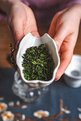 Herbal Bliss Freshly Dried Green Tea Leaves Cradled Gently in Hand Ready for Brewing