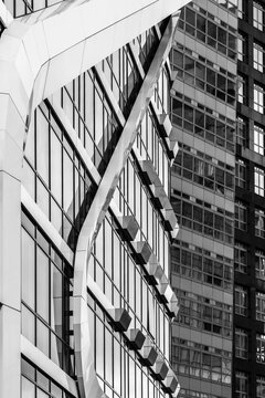 An artistic view of dynamic architectural forms interplaying within a modern urban landscape, emphasizing a unique style and innovative design principles in Amstedam