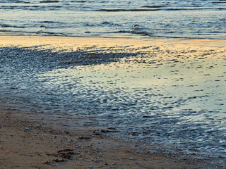 Sanlúcar de Barrameda beach. Opposite is the Doñana National Park. Sunset and fishing boats.