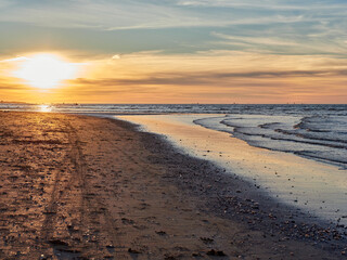 Sanlúcar de Barrameda beach. Opposite is the Doñana National Park. Sunset and fishing boats.