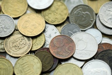 Big pile of different coins from various currencies and different countries around the world. Currency exchange