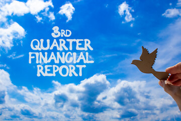 3rd quarter financial report symbol. Concept words 3rd quarter financial report. Beautiful blue sky and clouds background. Businessman hand. Business 3rd quarter financial report concept. Copy space.