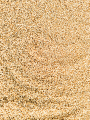 The title of the stock photo Background texture of processed organic wheat seeds and grains