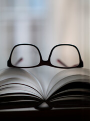 Glasses on top of  a book