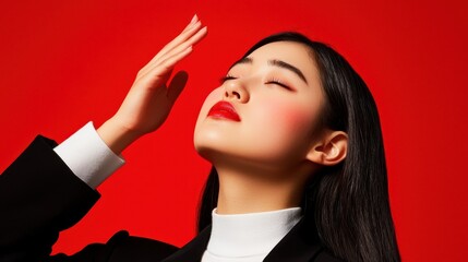 Obraz premium Elegance in Portrait Photography with Model on Vibrant Red Background