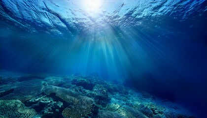 Fototapeta premium A stunning underwater scene with blue sunlight piercing the deep-sea abyss, creating tranquil patterns, ideal for marine-themed or nature-inspired visuals