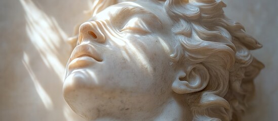 Close-up of Classical Sculpture of Jesus Christ in Marble with Dramatic Lighting Against Black Background