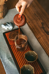 Experience the elegance of brewing tea using traditional teaware and fresh, aromatic tea leaves