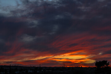 Fiery Sunset Clouds Illuminating the Evening Sky