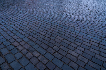 Paving stones. Stone pavement texture. Cobblestones on Red Square in Moscow. Perspective.