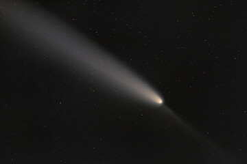 Obraz premium Real photo of comet C/2023 A3 (Tsuchinshan-ATLAS). Dark background. Soft focus.