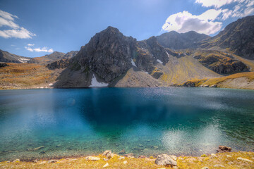 Lake with azure water in a mountain valley.