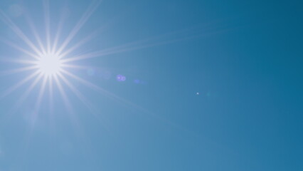 Bright Sun Of Spring Midday Sunlight At Daylight Sunshine Day. Clear Blue Sky With Lens Flares In Day. Nice Weather. Fresh Air.