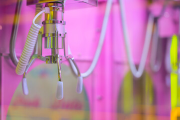 A Colorful Claw Machine Filled with Soft Plush Toys and Fun Offers.