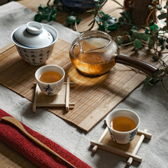 An Elegant Tea Ceremony Setup Featuring Beautifully Crafted Traditional Teaware and Accessories
