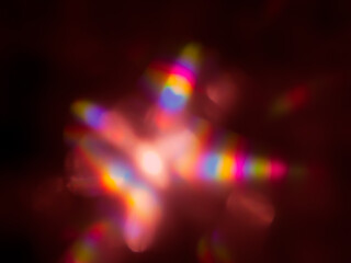 Pink blurred reflections in the dark for an abstract background.   