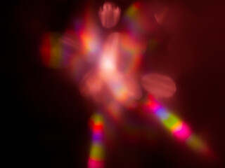 Pink blurred reflections in the dark for an abstract background.   