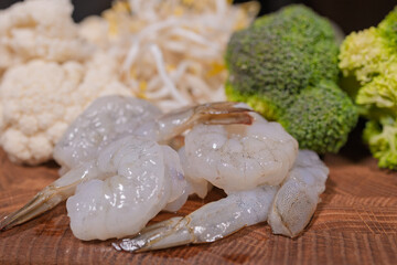 Cooking a dish, vegetables with shrimp and sauces