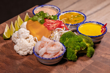 Cooking a dish, vegetables with shrimp and sauces