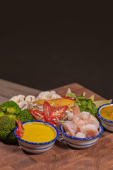 Cooking a dish, vegetables with shrimp and sauces