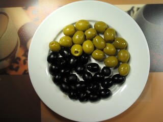 Black and green olives close view background