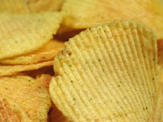 Potato chips or crisps close view background