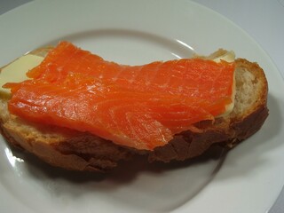 Salmon Sushi Dish with Fresh Produce and Tableware