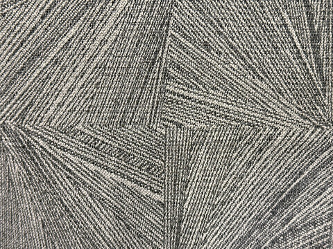 Close up of polyester fabric in contorted and distorted diamond shape pattern. Random abstract distorted slanted diamond in black and white color, seamless background. Optical illusion.
