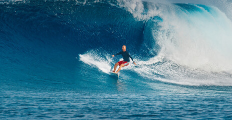 Pro surfer rides big wave in the Maldives
