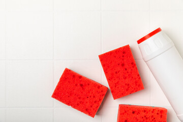 Colorful dish sponges on textured background. Kitchen sponge. Cleaning concept, cleaning service. Dishwashing liquid with clean and dirty dishes plate. Place for text, copy space. Wash the dishes.