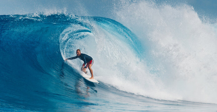 Pro surfer rides big wave in the Maldives