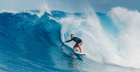 Pro surfer rides big wave in the Maldives