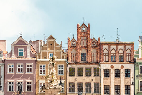 Proserpine Fountain with historic buildings at the old market square in Poznan Poland